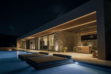  dining area & pool at night