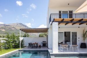 This trendy, modern villa in Plakias, Crete, is within walking distance of a sun-kissed sandy beach and numerous holiday conveniences.