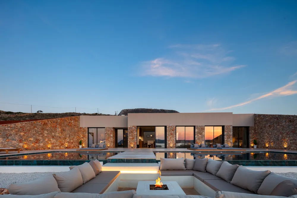  villa exterior and firepit at sunset