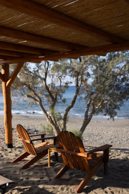  Relaxation area with chairs under pergola by beach