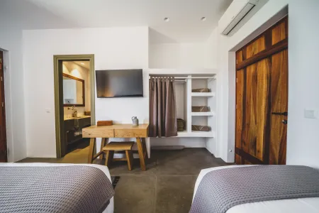  Two single beds beside wardrobe and wooden door